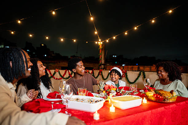 istock Family talking during christmas dining on house rooftop 2226641446