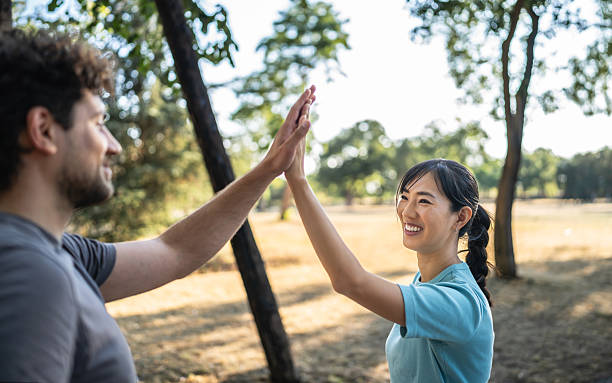 istock Young couple giving high five after exercising in the park 2226642807