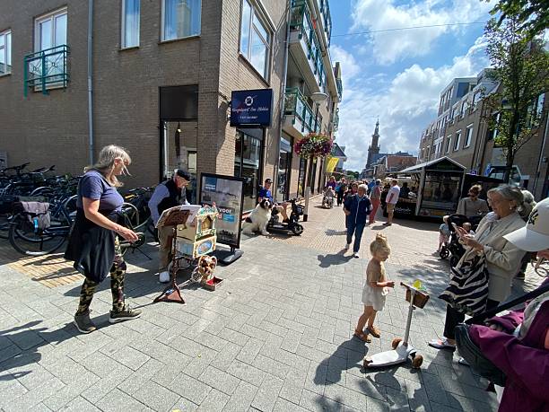 Egmond aan Zee,  Netherlands - July 22, 2025.  People enjoy the weekly Market in the monumental City.