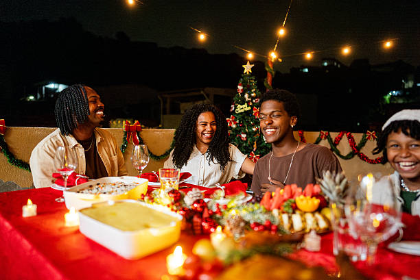 istock Family talking during christmas dining on house rooftop 2226643321