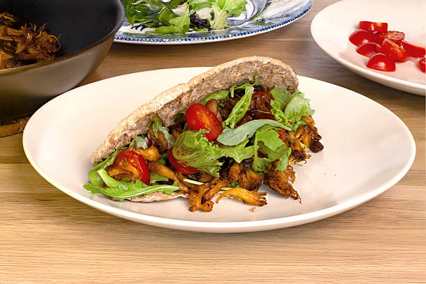 istock Crispy Pulled Lion's Mane Mushroom Pita on White Plate 2226647055