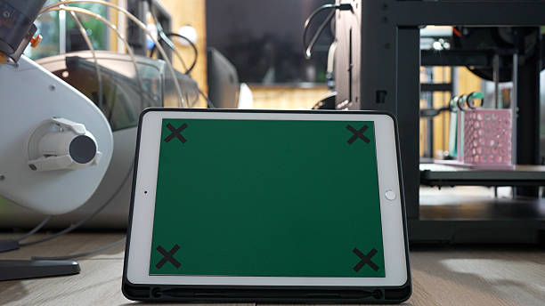 Green screen of digital tablet in 3d printing workshop. Technology and 3d printing concept.