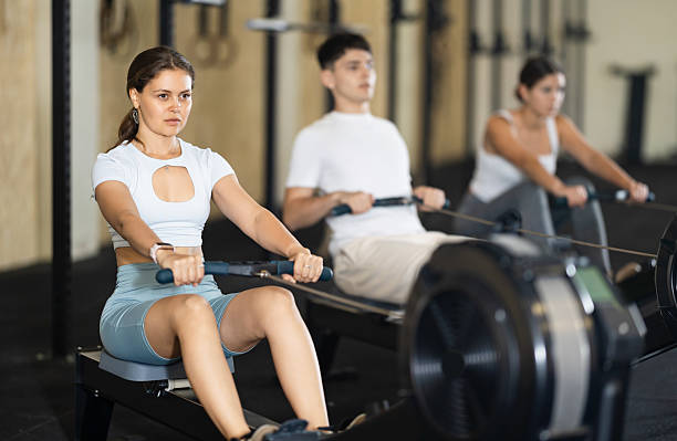 istock Young woman training her arms on machine 2226651337