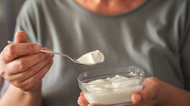 istock Yogurt eating concept, natural healthy probiotic 2226651367