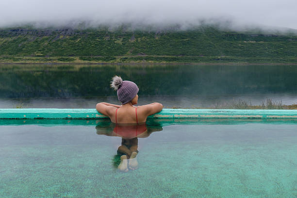 istock Relaxing in Icelands geothermal waters surrounded by misty mountains and tranquil lakes 2226651674