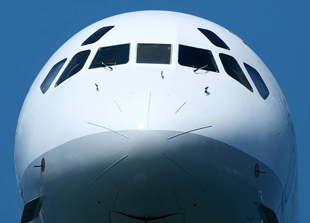 istock Airplane Nose Close-Up with Cockpit Windows, Front View of Modern Passenger Airplane 2226655745