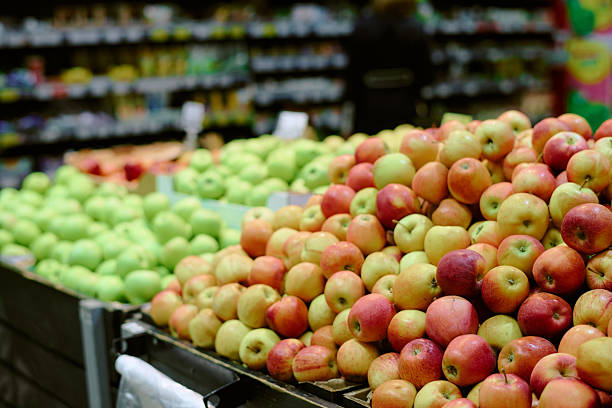 istock Displaying Vibrant Fresh Apples in Grocery Store Aisle 2226656564