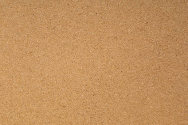 istock Brown cardboard paper texture background. Natural recycled craft paper sheet surface for design, packaging, or vintage wallpaper. Abstract, clean, and empty backdrop with copy space. 2226661070