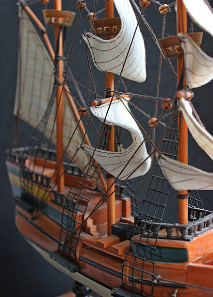 istock Upper Deck and Stern of a Three Masted Sailing Ship Model with Sails Downwind over Dark Backdrop 2226662372