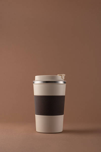 istock Reusable coffee  thermo cup, mockup on warm beige background 2226666354