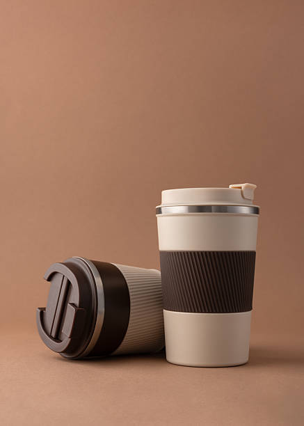 istock Reusable coffee  thermo cup, mockup on warm beige background 2226666459