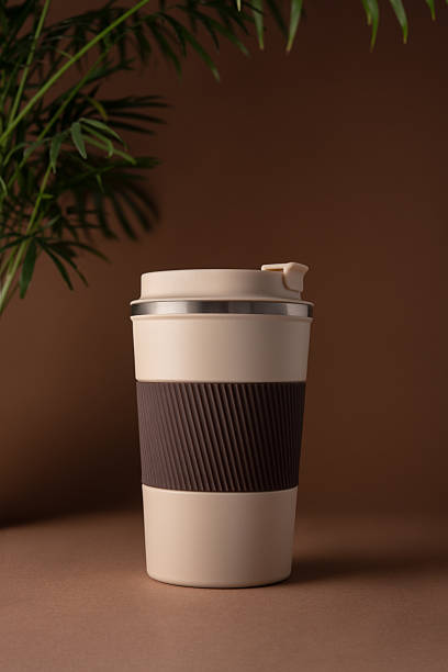 istock Reusable coffee  thermo cup, mockup on warm beige background with natural shadows 2226666487