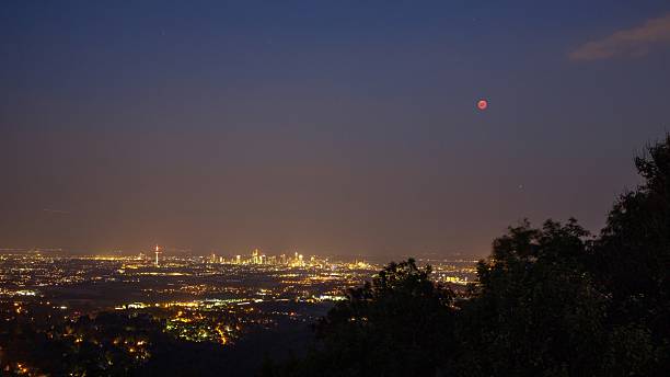 istock Frankfurt skyline with blood moon at night 2226667620