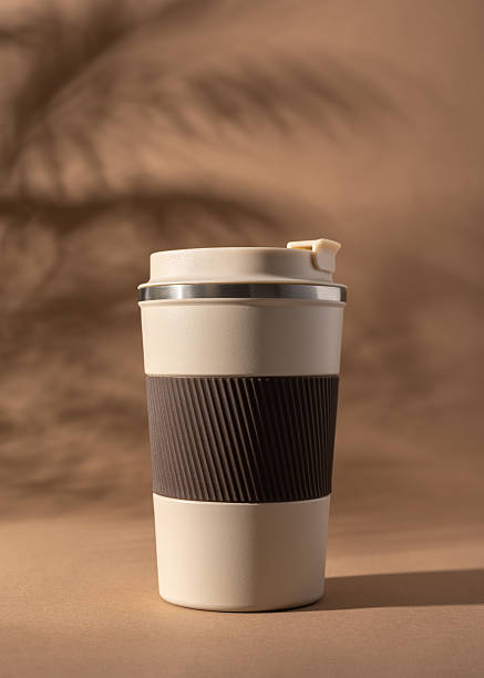 istock Reusable coffee  thermo cup, mockup on warm beige background with natural shadows 2226668152