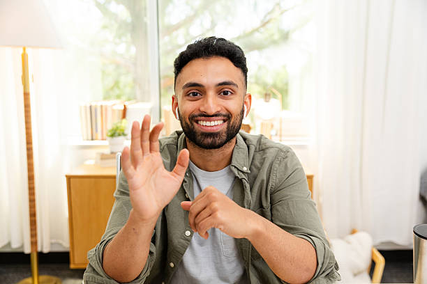 istock Smiling Man Waving During a Video Conference Call 2226673752