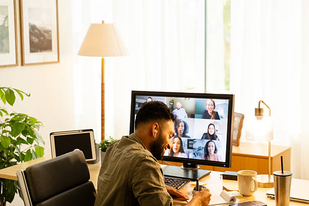 istock Man in video conference with diverse colleagues 2226673753