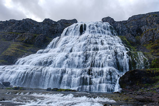 istock Majestic waterfall cascading down rocky cliffs in Iceland during overcast weather 2226674260