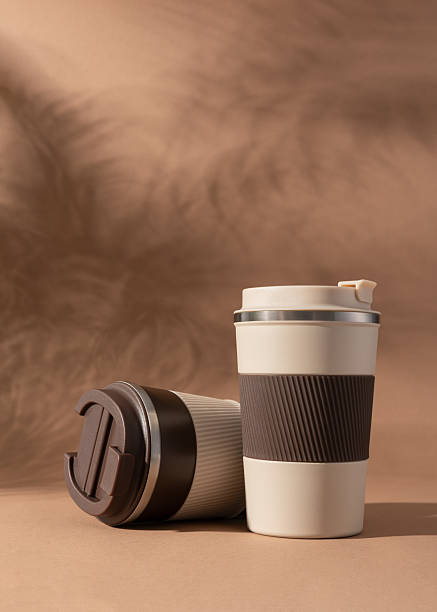 istock Reusable coffee  thermo cup, mockup on warm beige background with natural shadows 2226675657