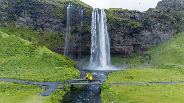istock Explore the breathtaking Seljalandsfoss waterfall surrounded by lush Icelandic landscapes 2226678245