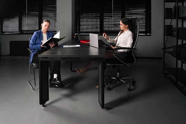 istock Business meeting in a modern office with two professionals discussing reports 2226678637