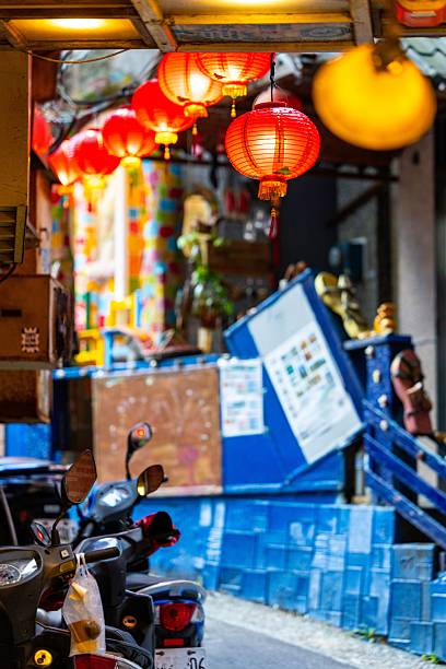 istock Vibrant red lanterns illuminate a narrow alley. 2226679779
