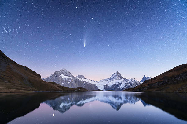 istock Alpine lake Bachalpsee under night starry sky with snow-covered peaks 2226680129