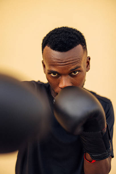 istock Focused athlete wearing gloves prepares for a punch in boxing practice 2226682066