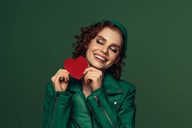 istock Holding Love Close: A Radiant Smile with a Heartfelt Touch 2226687976