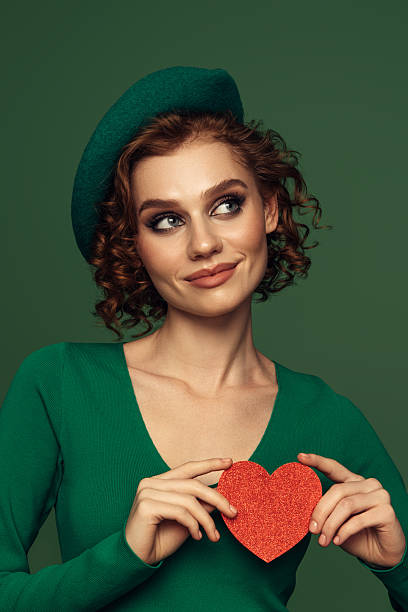 istock Holding Love Close: A Radiant Smile with a Heartfelt Touch 2226688383