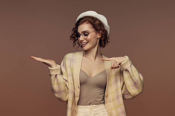 istock Chic Elegance: Woman Gesturing with Joy and Style 2226688999