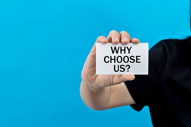 istock Woman hand holding a paper with text why choose us 2226692260