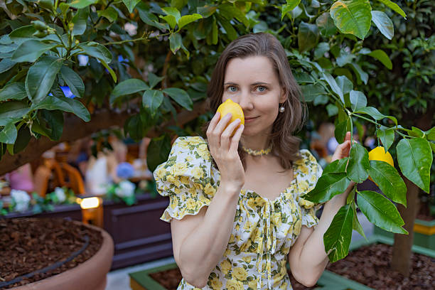 istock Woman enjoying a sunny day at a lemon tree 2226693011