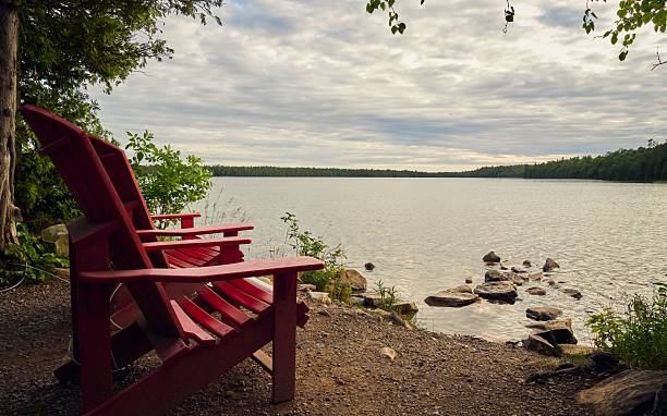 istock Adirondack Chair by a Serene Lake 2226694042