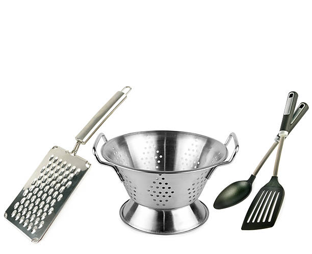 istock Colander, grater kitchen spoon and spatula isolated on white background. 2226696120