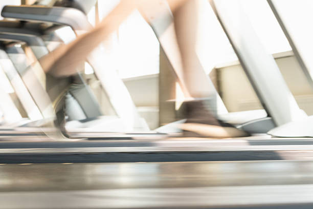 Women leg running on treadmills.