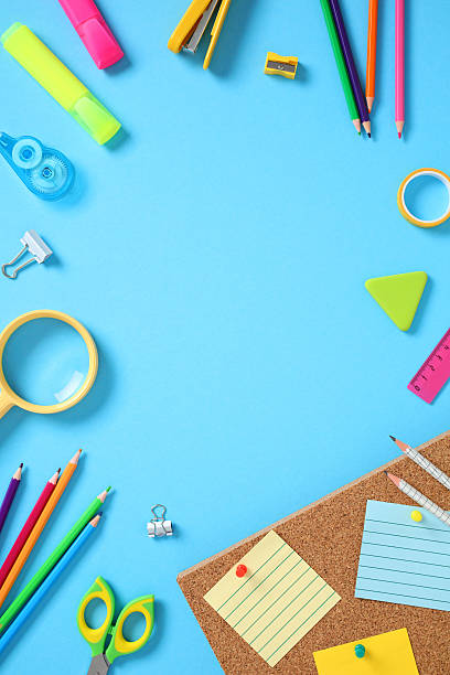istock Flat lay frame of school supplies on a blue background 2226698797