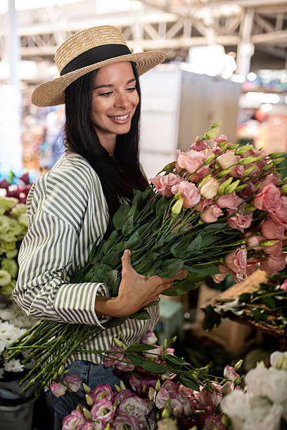istock Woman Admiring Fresh Bouquet 2226699633