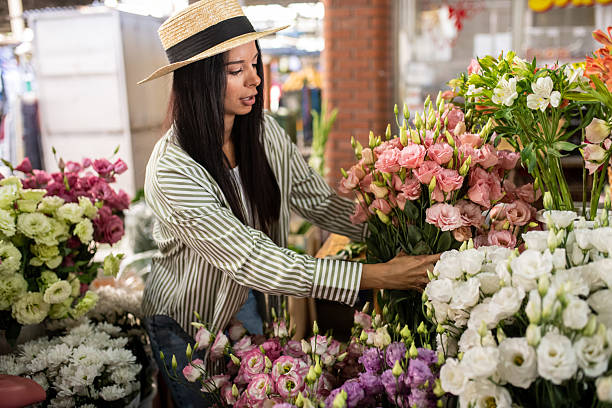 istock Woman Reaches for Fresh Flower 2226699674