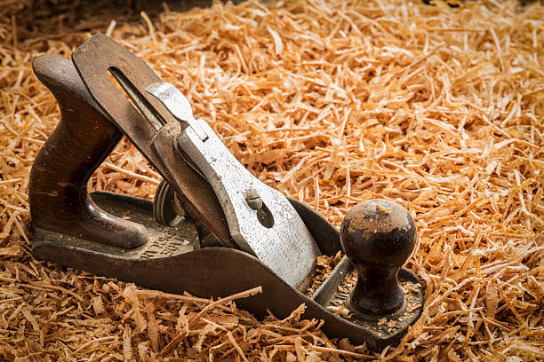 Carpentry themes: Close up of  plane hand tool part of carpentry tools on a workbench