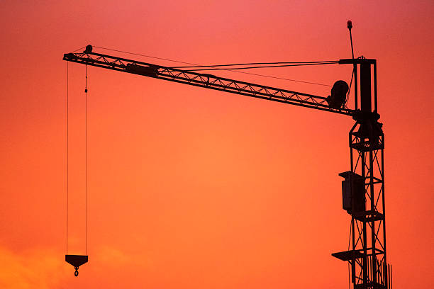 istock Silhouette of a crane on construction site 2226703595