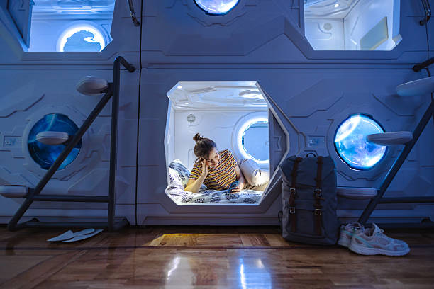 istock Comfortable futuristic capsule bed with ambient lighting and modern travel accessories 2226703992