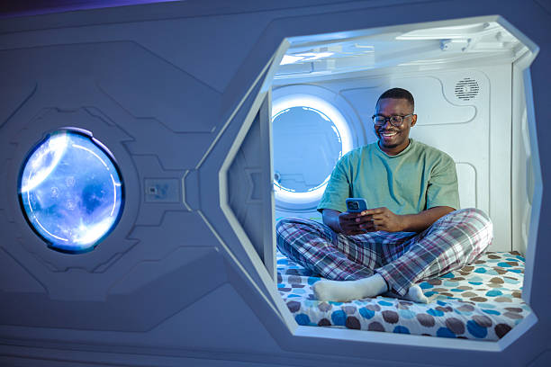 istock Man relaxing inside modern capsule with futuristic lighting and serene atmosphere 2226705201