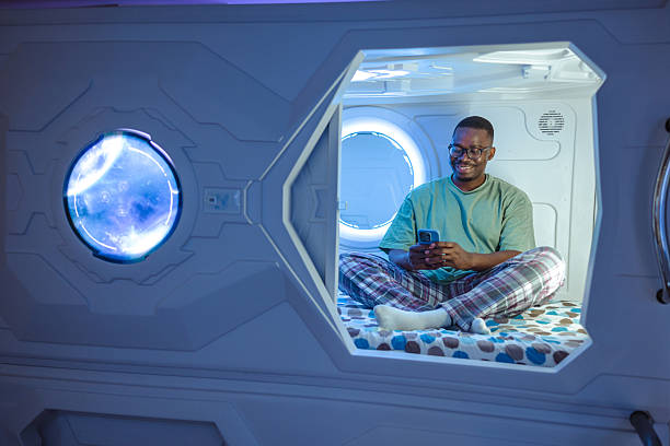 istock Man relaxing inside modern capsule with futuristic lighting and serene atmosphere 2226705363