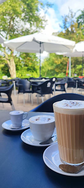 three different types of coffee, espresso, cappuccino, and latte served outdoors at a ?afe in Portugal. Concept of the countrys coffee culture and beverage themes.