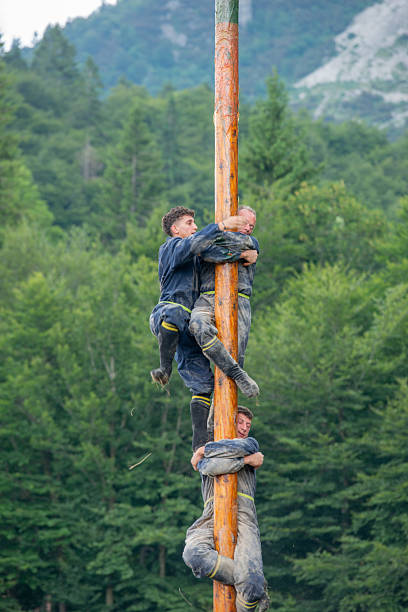 Bergamo Italy 20 July 2025: Participants in the popular festival challenge each other by trying to reach the top of the pole