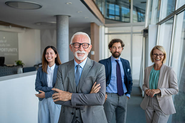 istock Successful business team smiling at the camera in modern office 2226717135