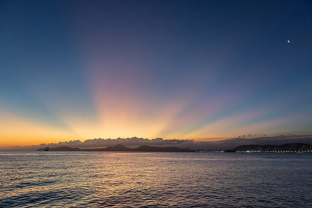 Dawn in Morro das Pedras in the south of the island of Santa Catarina (Florianópolis) . Located in the right corner of campeche beach bordering the left corner of Armação beach. Place with excellent waves for surfing.