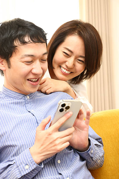 istock Couple using smartphones on the sofa 2226721671