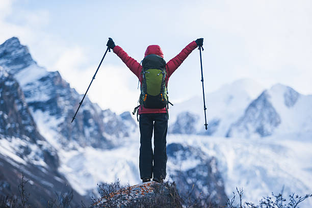 istock Backpacking woman hiking around the large hanging glacier on high altitude mountain top 2226724708