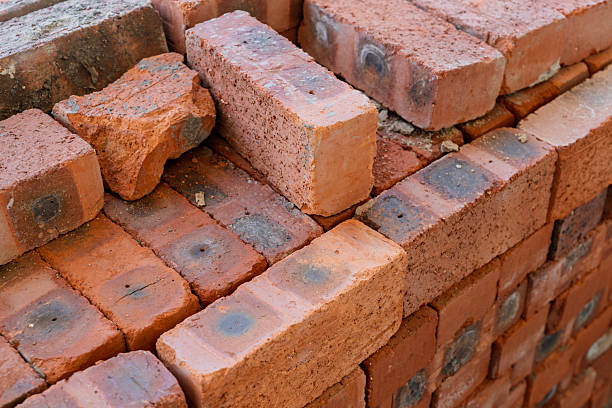 istock Stacked Red Bricks with Burn Marks and Imperfections 2226726215